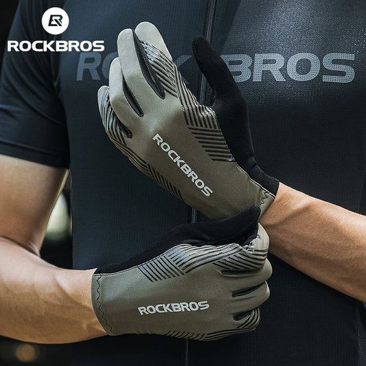 Person wearing RockBros gloves with a dark background