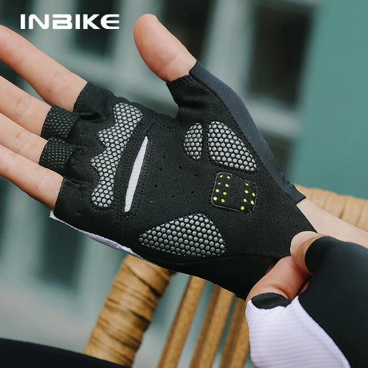 Black cycling glove with text 'INBIKE' held by a person.